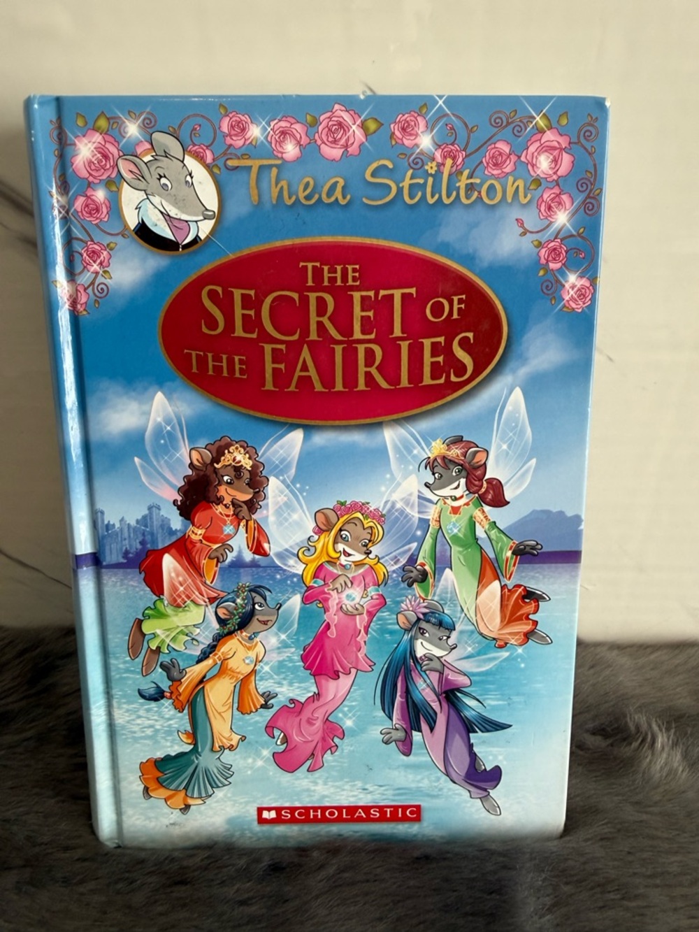 Scholastic Bright Blue Hardcover with Pink Rose Accents